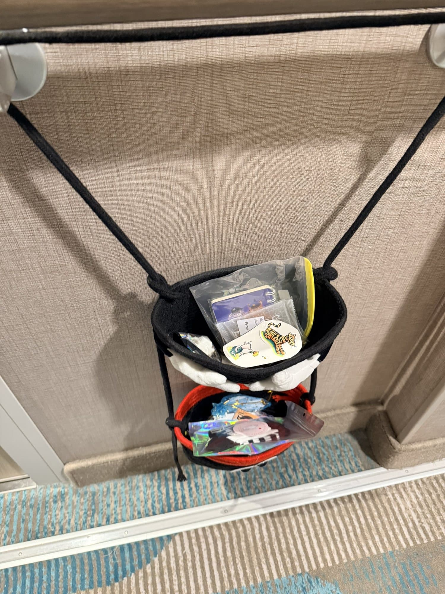 Our Mickey Mouse Pixie Dust collection bag on the door, filling up with small gifts.