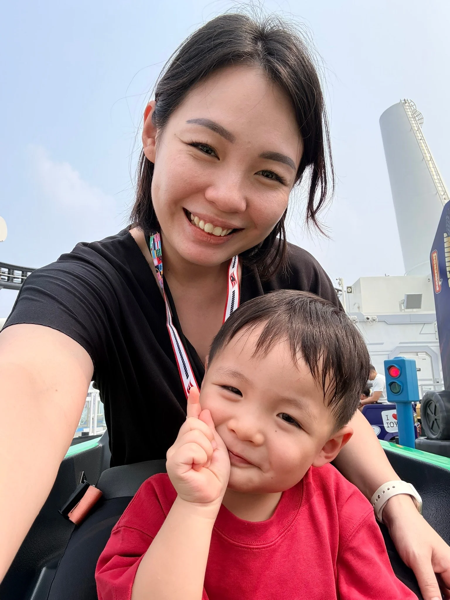Joanna and Ethan smiling on the Groot Galaxy Spin ride.