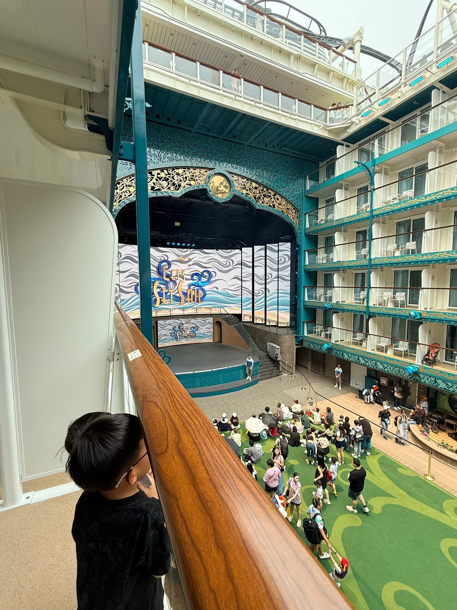The view of Garden Stage from our Deck 12 verandah, with the teal-green pillar partly in the way.