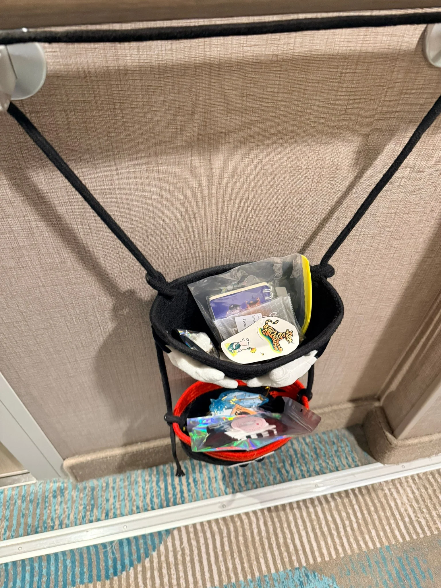 Our Mickey Pixie Dust gift holder on the door, filling up with small gifts.