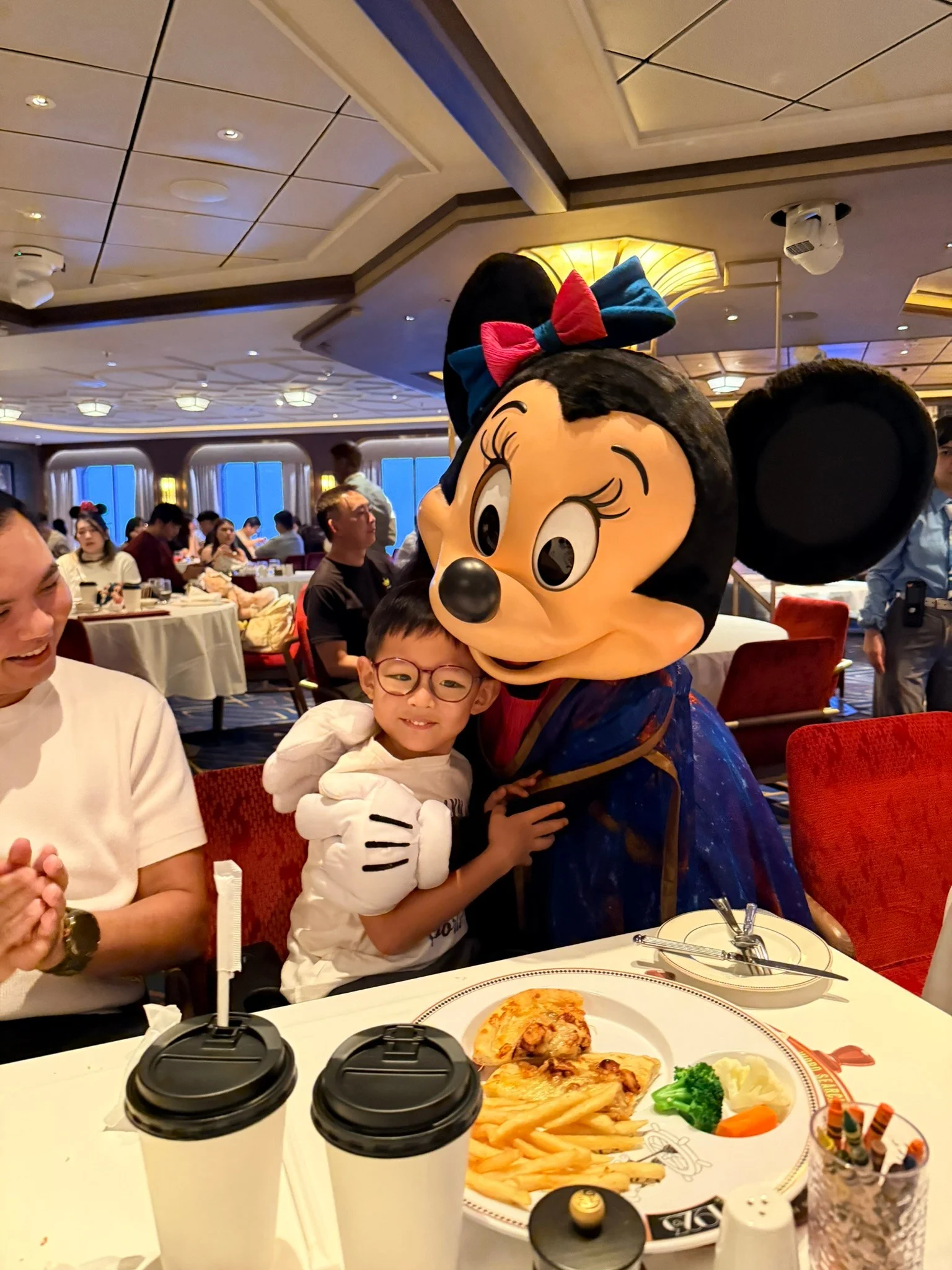 Lucas getting a hug from Minnie at our table at Navigator’s Club.