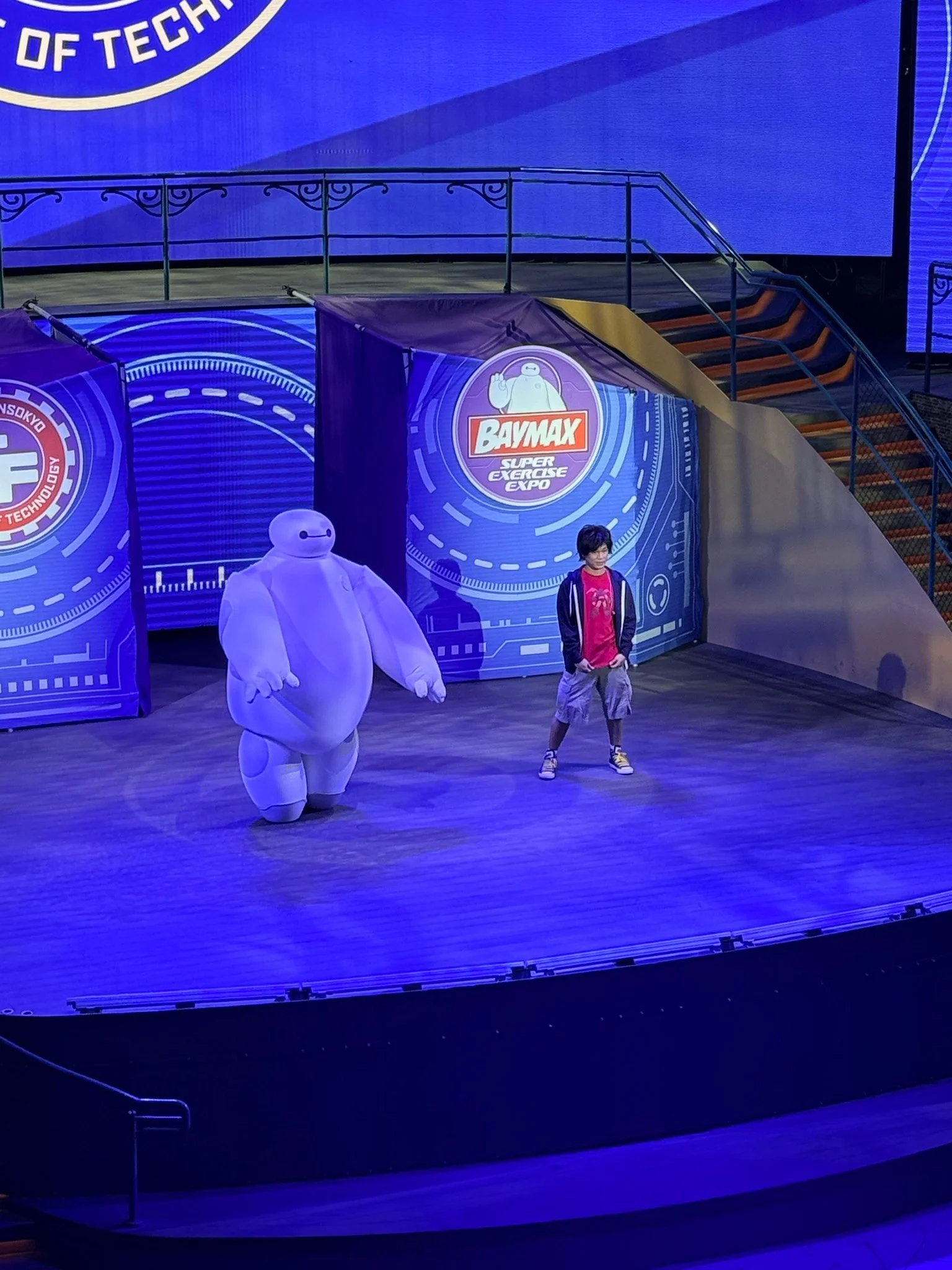 Baymax leading the workout show on Garden Stage, seen from our verandah.