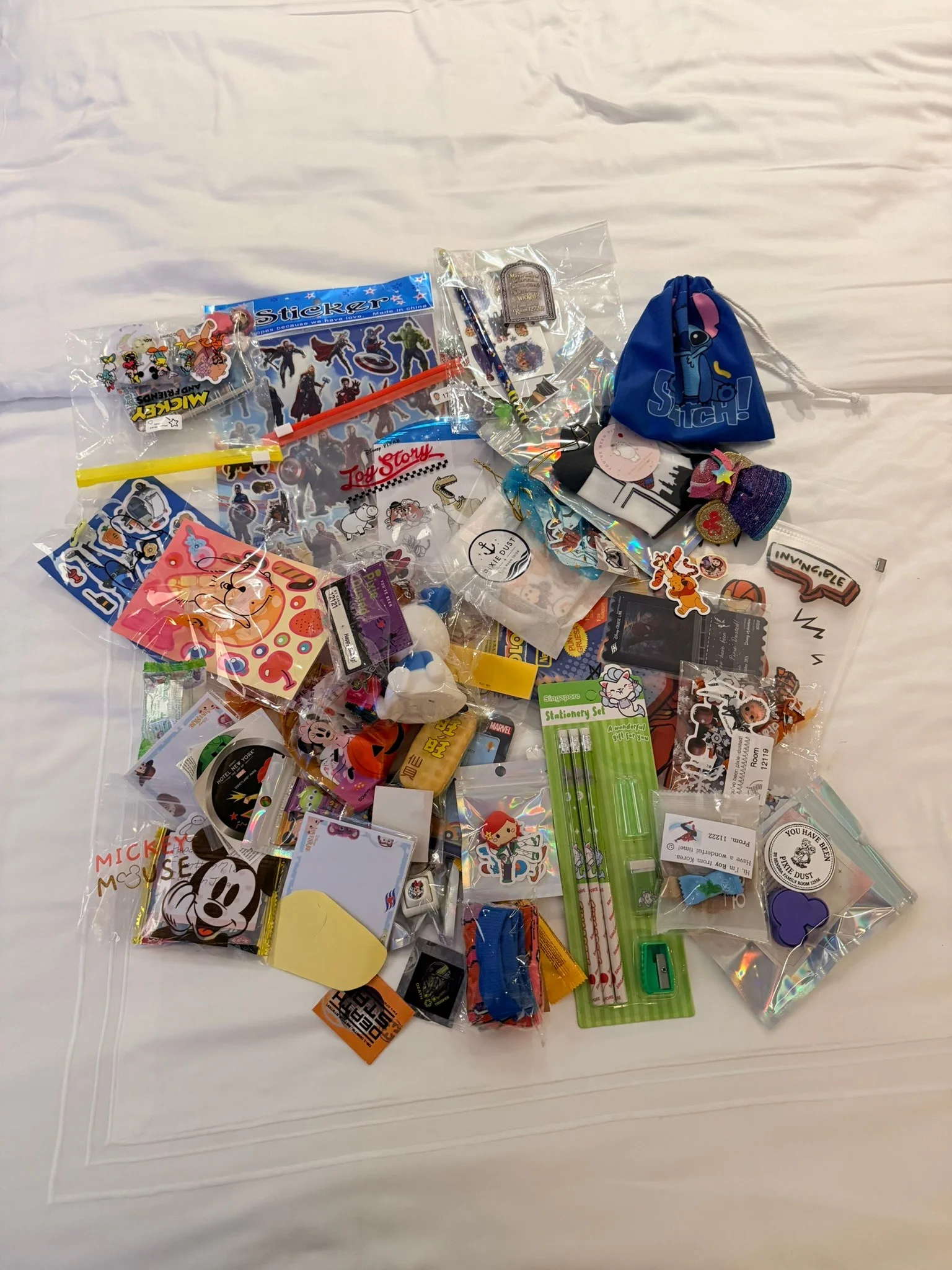 The small gifts we received from other guests, spread out on the bed.