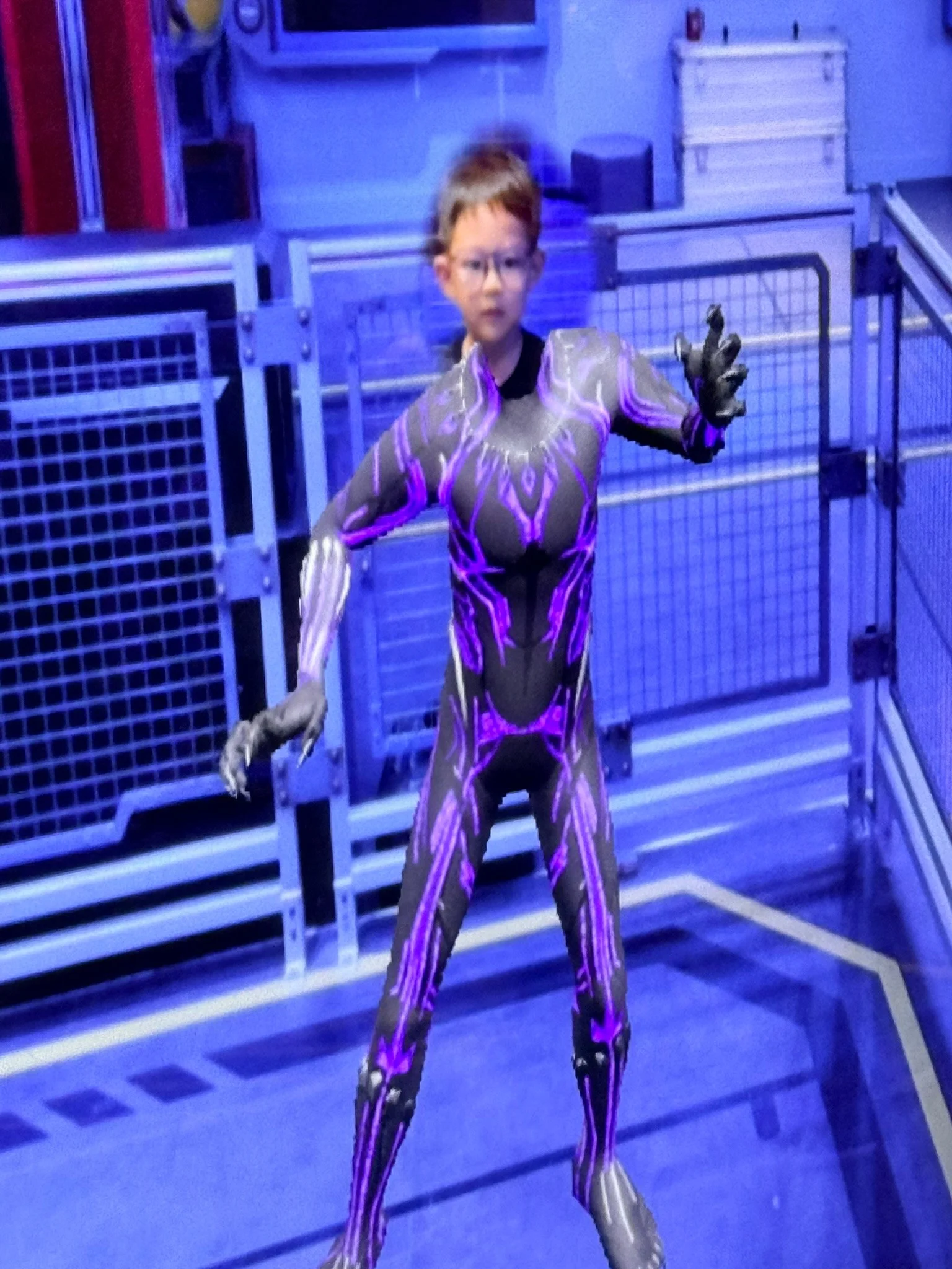 Lucas appearing as Black Panther on screen in the superhero training game.