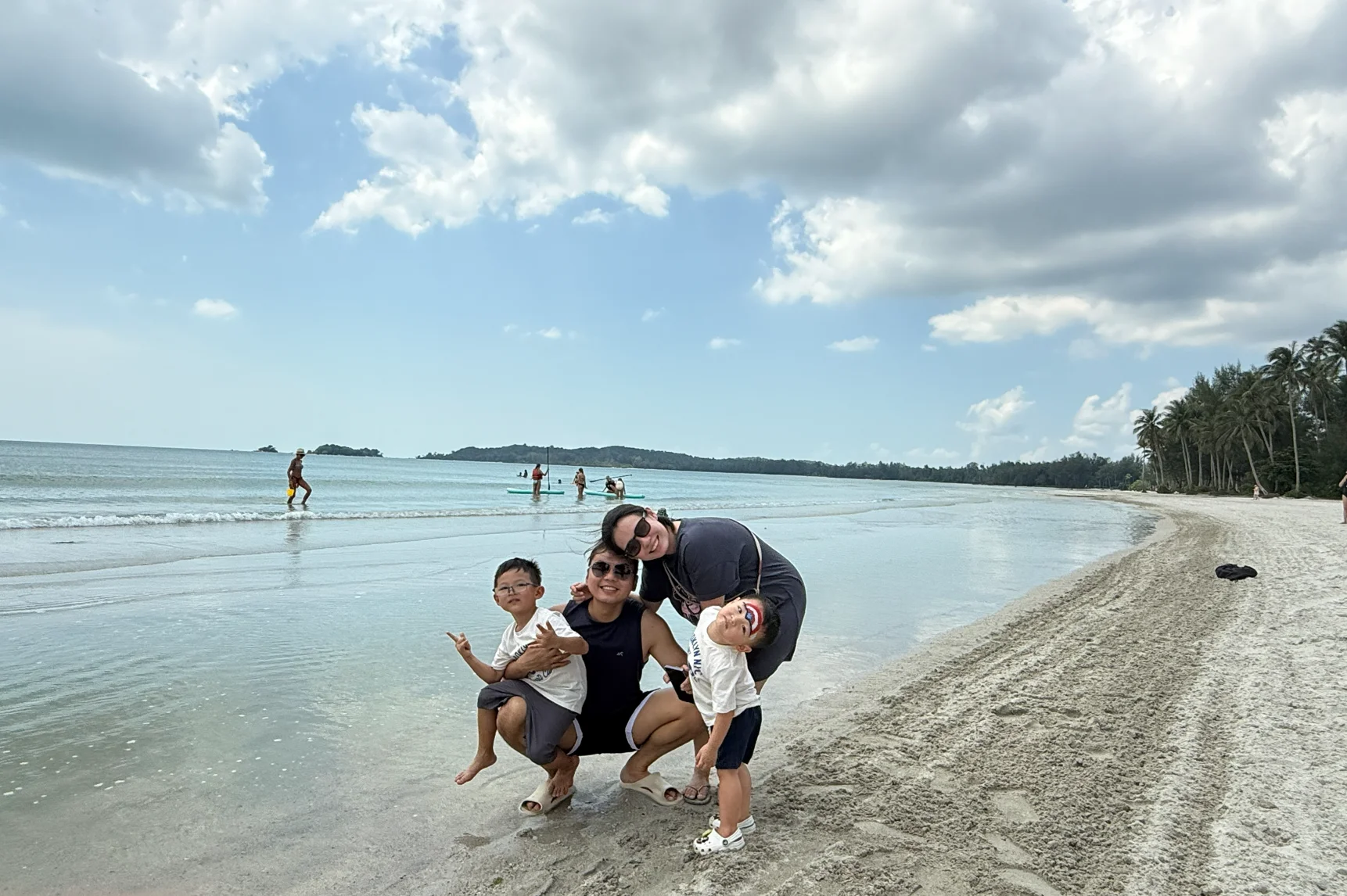 Family time together on the sandy beach at Bintan.