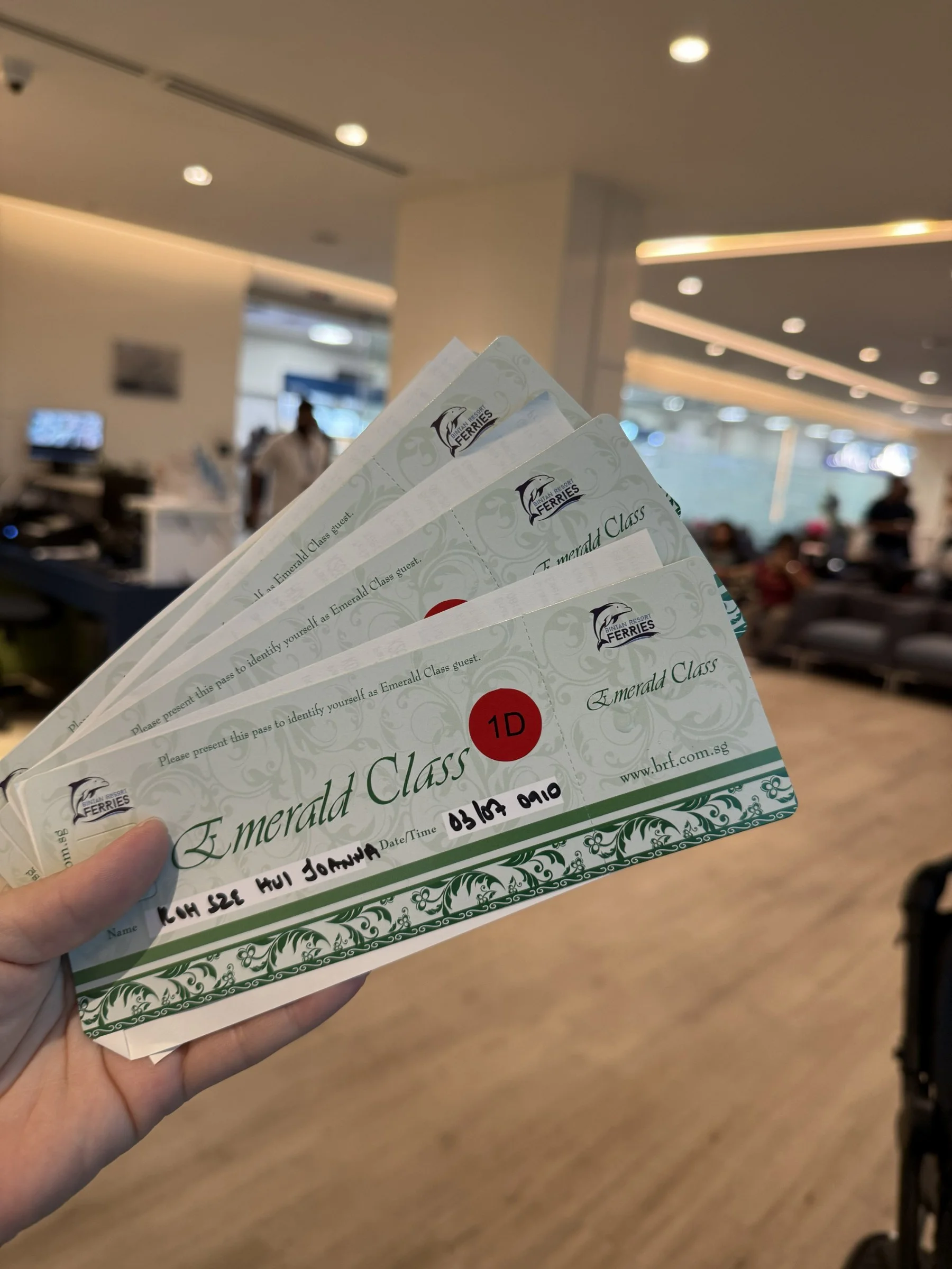 Emerald Class ferry tickets held up inside the passenger terminal.